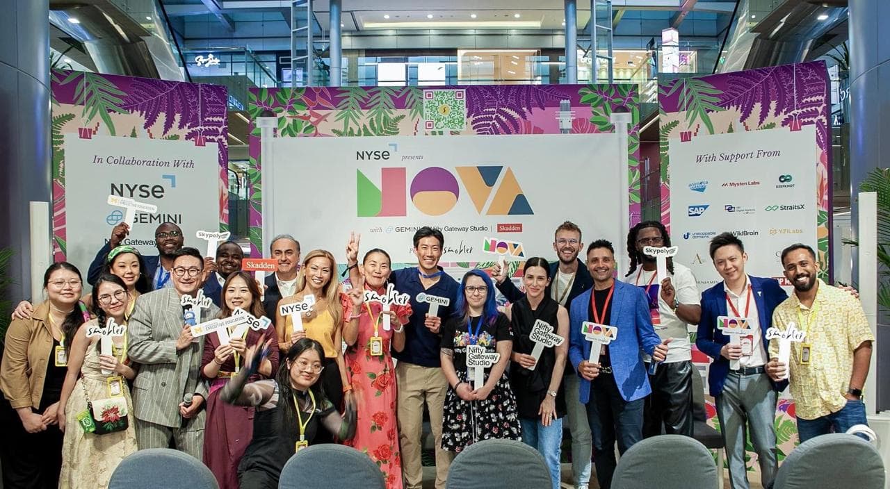 Smobler’s team and guests on stage at NOVA Singapore 2025, in front of a NYSE-presented NOVA backdrop.