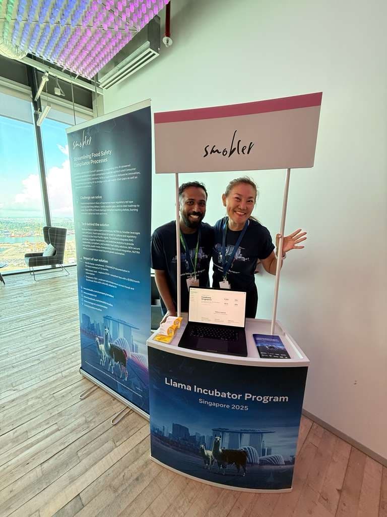Dr Loretta Chen and Mridhul Pax behind a Smobler booth at the Llama Incubator Program, Singapore 2025.